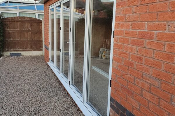 Aluminium-Bi-folding-doors-installed-in-to-new-rear-extension-scaled