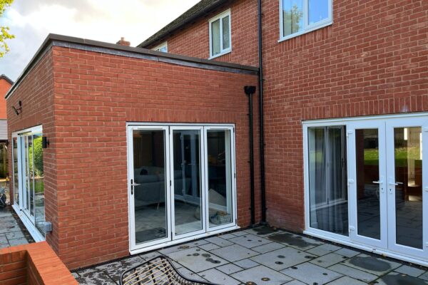 Aluminium-Bifolding-doors-installed-in-to-side-of-new-Orangery